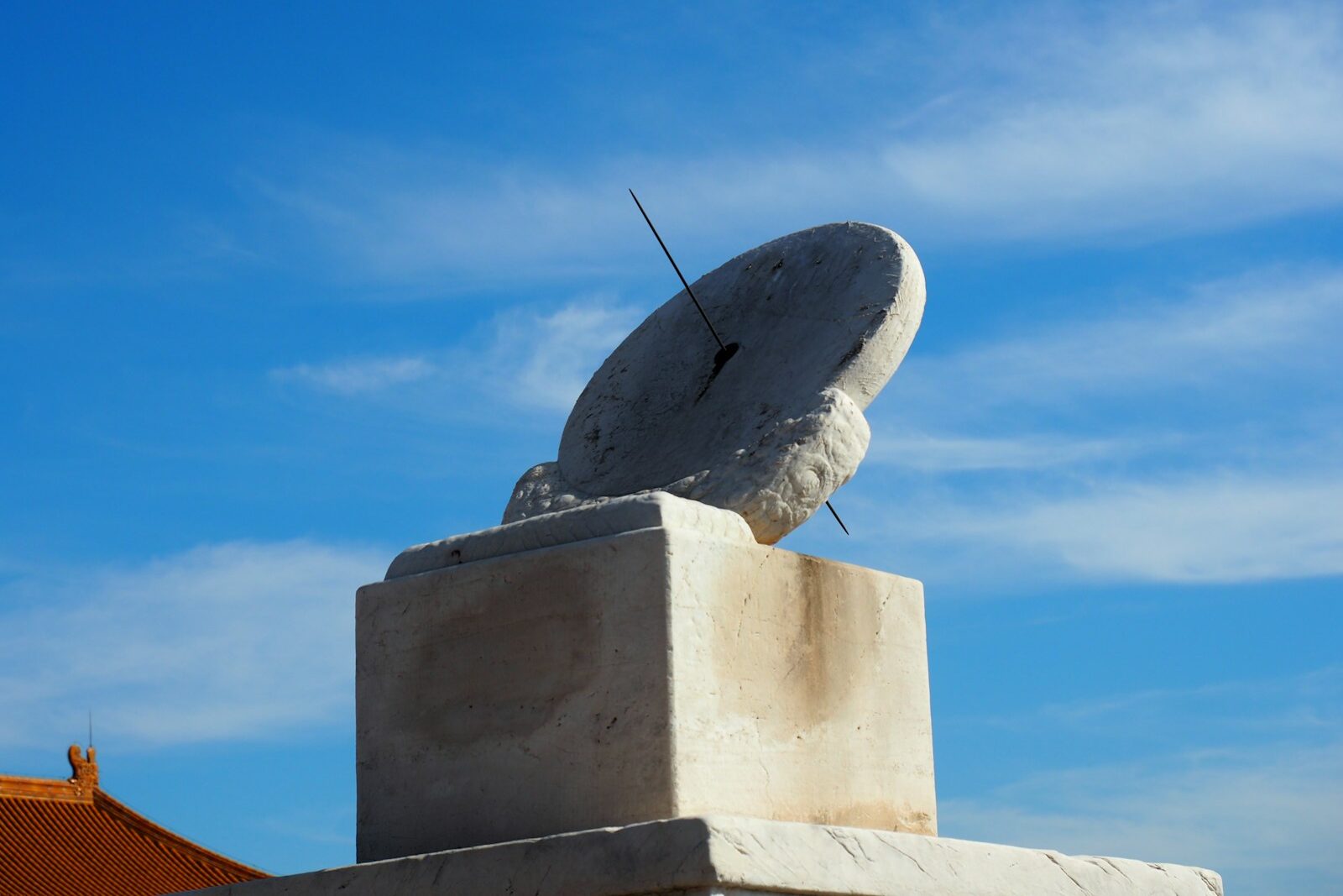 a sculpture of a satellite dish on top of a building